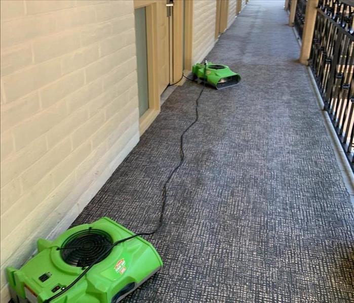 Drying equipment set up in hallway.