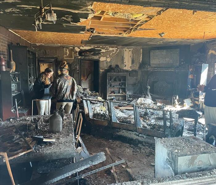 Severe fire damage inside home with black soot