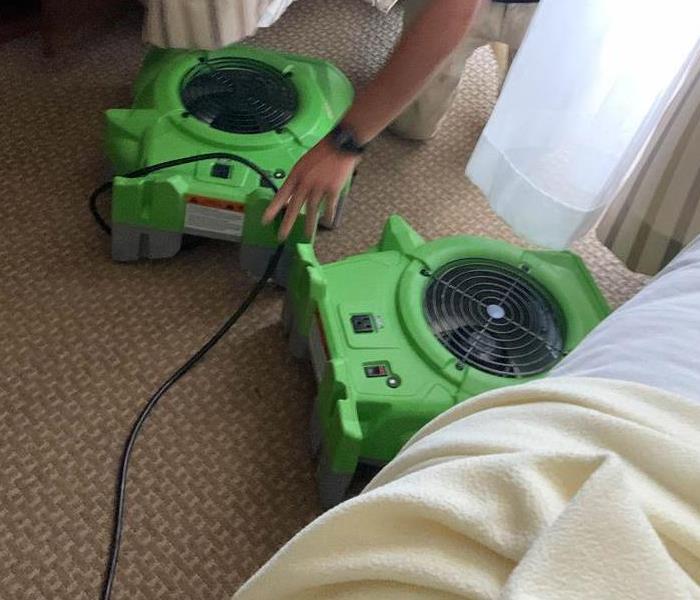 Air movers on floor.