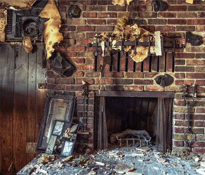 Fireplace in a home. Fire and smoke damaged furniture in a family home.